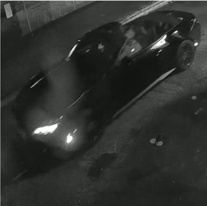 Surveillance image of a black Ford Mustang