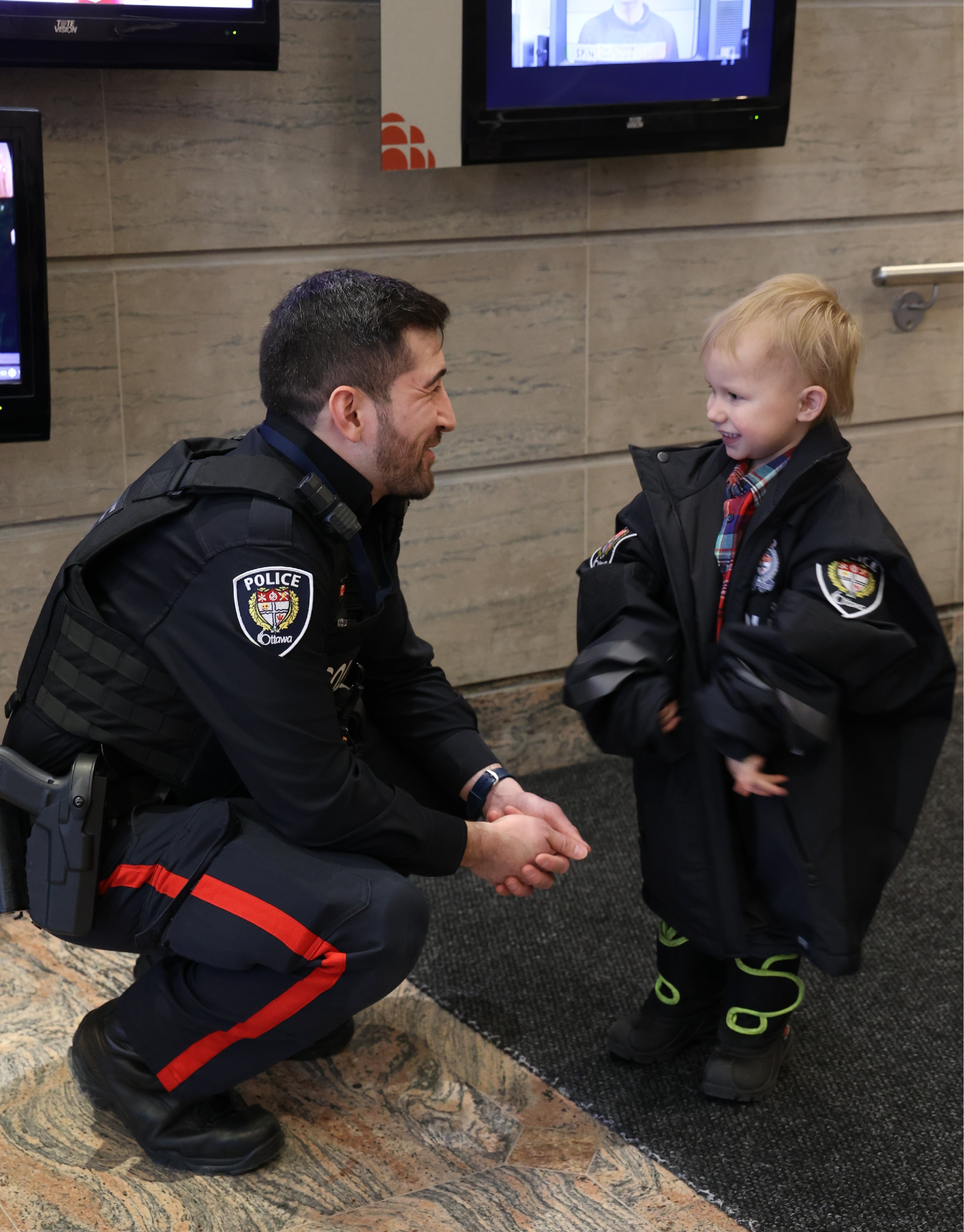 Cst. Liu and Jack reunite in the lobby of the CBC building on Queen Street.